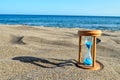 Hourglass Clock on the Sand Beach