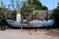 Old and broken wooden boat stranded