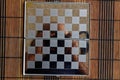 Photo with a picture of a steel chess Board. Metal board with reflection