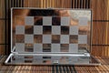 Photo with a picture of a steel chess Board. Metal board with reflection