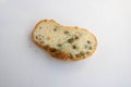 Photo of a piece of white bread covered with mold on a white background Royalty Free Stock Photo