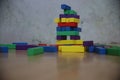 a pile of colorful rectangle shaped wooden bricks