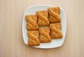 The photo of a pile of cookies or shortcake biscuits on the plate