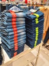 This is a photo of a pile of jeans in a supermarket