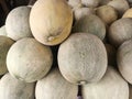 Photo of a pile of large, fresh melons that are ripe, the inside is fresh, green and yellow. Royalty Free Stock Photo