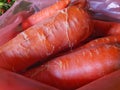 Photo of a pile of orange carrots on the table