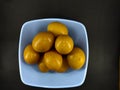 Raw eggs in a blue bowl isolated on a black - STOCK PHOTO Royalty Free Stock Photo