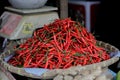Photo of a pile of very spicy cayenne chili peppers in the basket.