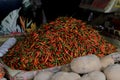 Photo of a pile of very spicy small chili peppers in the basket.