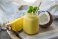 Photo of pineapple smoothie in jar with straw on light background. Fresh organic Smoothie. Health or detox diet food Royalty Free Stock Photo