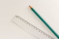 Plastic ruler and wood pencil on white Royalty Free Stock Photo