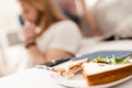 Photo of plate with sandwiches with lettuce, on couch