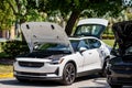 Photo of a Polestar electric vehicle on display with front trunk open to show cargo space