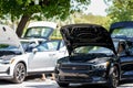 Photo of a Polestar electric vehicle on display with front trunk open to show cargo space