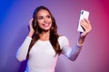 Photo of popular celebrity lady hold phone take party selfie wear white shirt neon gradient color background