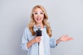 Photo of popular correspondent hold mic talk speak tell news wear specs blue shirt isolated grey color background