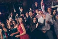 Photo portrait of active young people dancing at new year party