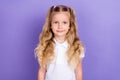 Photo portrait of adorable little pupil girl ponytails smiling dressed trendy white blouse uniform on violet