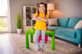 Photo portrait of adorable small girl crossed hands remote home lesson dressed stylish yellow garment preschoolers Royalty Free Stock Photo