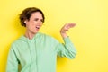 Photo portrait of adorable young woman irritated teasing talking hand blah dressed stylish green outfit isolated on Royalty Free Stock Photo