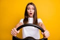 Photo portrait of afraid fear brunette girl holding steering wheel driving first time vivid yellow color