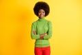 Photo portrait of african american businesswoman with crossed arms isolated on vivid yellow colored background