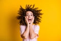 Photo portrait of amazed curly girl laughing touching cheeks with both hands opened mouth isolated on bright yellow Royalty Free Stock Photo