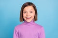 Photo portrait amazed schoolgirl staring happy isolated pastel blue color background