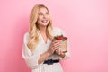 Photo portrait of attractive blonde woman hold strawberry look empty space dressed stylish white clothes isolated on