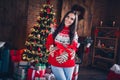 Photo portrait of attractive brunette young woman hold give present box dressed ornament sweater living room christmas Royalty Free Stock Photo