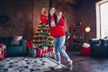 Photo portrait of attractive brunette young woman winning raise fists dressed ornament sweater living room christmas Royalty Free Stock Photo