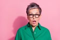 Photo portrait of attractive pensioner woman shocked expression open mouth dressed stylish green clothes isolated on Royalty Free Stock Photo