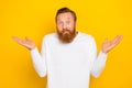 Photo portrait of attractive young man shrugging shoulders puzzled unsure wear stylish white clothes isolated on yellow