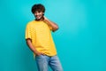 Photo portrait of attractive young man touch neck shopping promo dressed stylish striped yellow clothes isolated on cyan