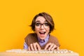 Photo portrait of attractive young woman closeup web camera type keyboard dressed retro office clothes isolated on Royalty Free Stock Photo