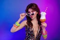 Photo portrait of attractive young woman cocktail look empty space isolated on retro neon gradient light background Royalty Free Stock Photo