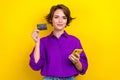 Photo portrait of attractive young woman hold credit card gadget wear trendy violet smart casual outfit isolated on Royalty Free Stock Photo