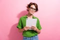 Photo portrait of attractive young woman hold tablet ereader wear trendy green clothes isolated on pink color background