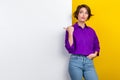 Photo portrait of attractive young woman look point blank wall wear trendy violet smart casual clothes isolated on