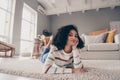 Photo portrait of attractive young woman lying floor dreamy smile dressed casual clothes cozy day light home interior Royalty Free Stock Photo