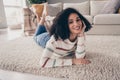 Photo portrait of attractive young woman lying floor dreamy smile dressed casual clothes cozy day light home interior Royalty Free Stock Photo