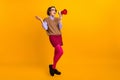 Photo portrait of attractive young woman moody scream megaphone dressed retro office clothes isolated on yellow color Royalty Free Stock Photo