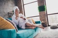 Photo portrait of attractive young woman sit sofa drink tea head wrapped towel dressed bath robe home interior enjoy Royalty Free Stock Photo