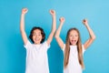 Photo portrait boy girl smiling gesturing like winners happy isolated pastel blue color background Royalty Free Stock Photo