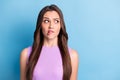 Photo portrait of brunette with doubt clueless misunderstanding face biting lip isolated on vibrant blue color Royalty Free Stock Photo