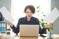 Photo portrait of business woman preparing documents working at office overwhelmed with working tasks grimacing angry