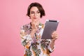 Photo portrait business woman in shirt glasses keeping tablet contemplated thoughtful isolated pastel pink color