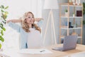 Photo portrait business woman wearing glasses smiling sitting at table with laptop chilling on break relaxing at home Royalty Free Stock Photo