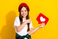 Photo portrait of charming schoolgirl finger point heart notification dressed stylish white garment isolated on yellow