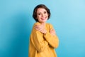Photo portrait of cheerful girl embracing hugging herself wearing casual fall jumper isolated on bright blue color Royalty Free Stock Photo
